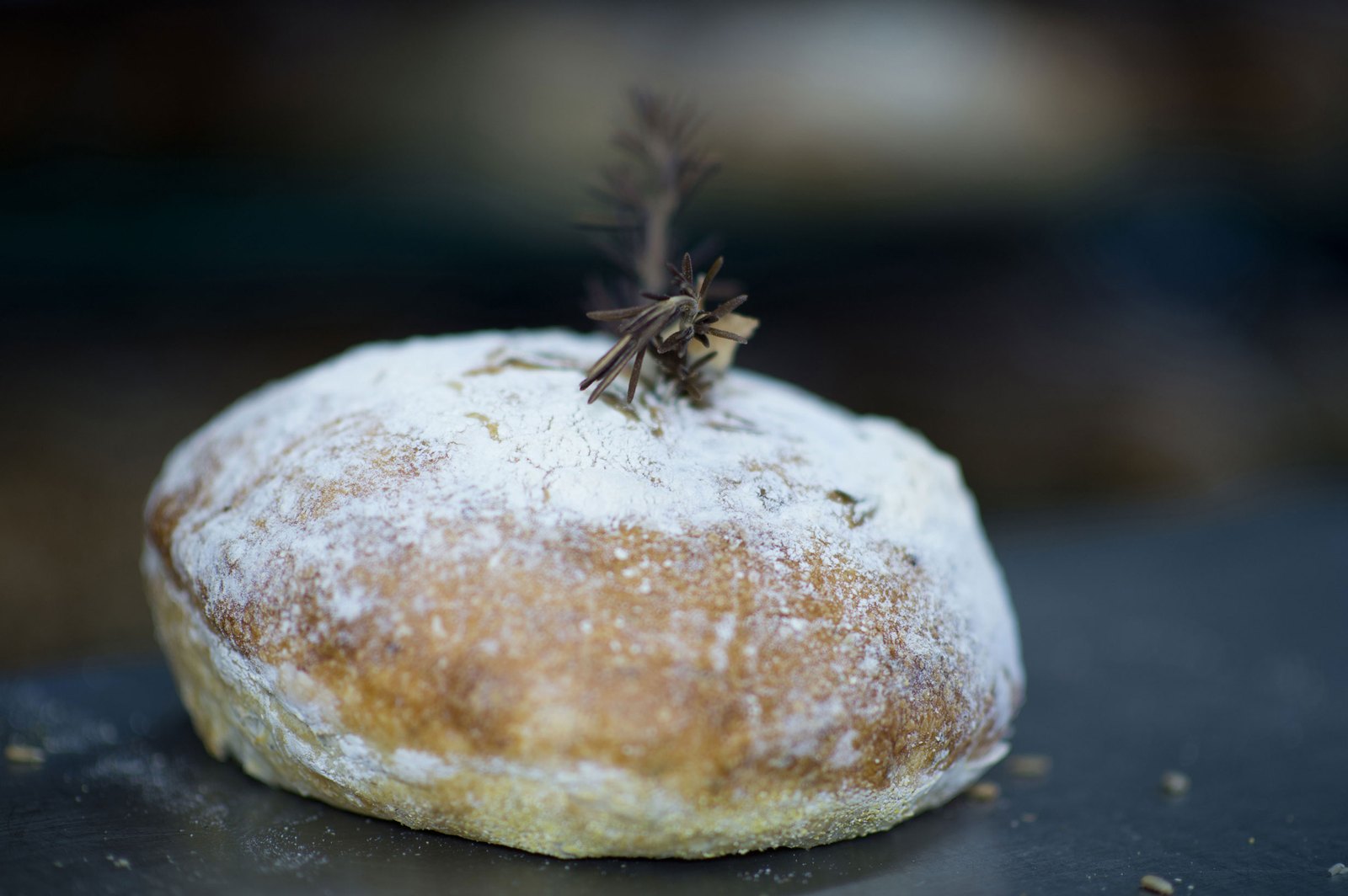 Flour-dusted boule topped with rosemary